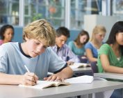 Schoolboy in high school class