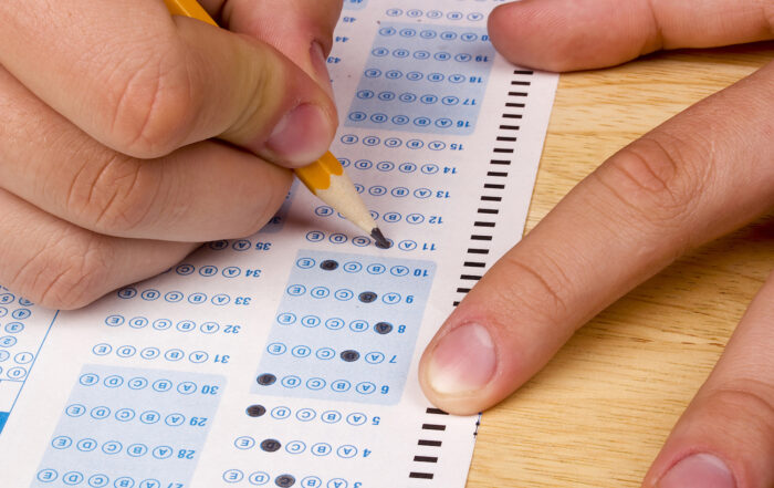 student bubbling in answer sheet for an ACT exam