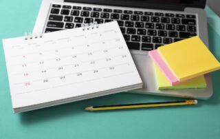 summer study plan calendar and laptop