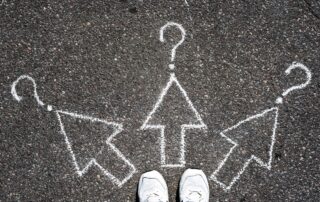 Arrows drawn in chalk on asphalt in front of your steps; students must make difficult choices (like in choosing a career).