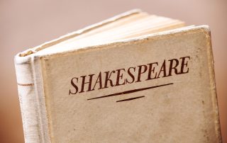 An old book titled Shakespeare, symbolizing his monumental contribution to English literature