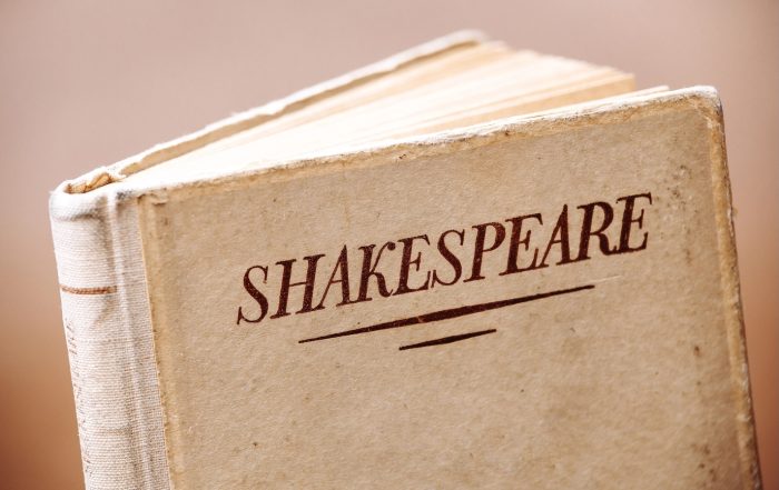 An old book titled Shakespeare, symbolizing his monumental contribution to English literature
