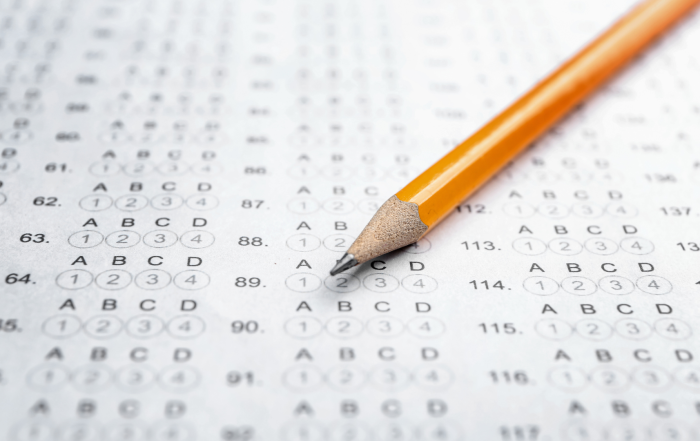 A pencil sits on a test scantron.