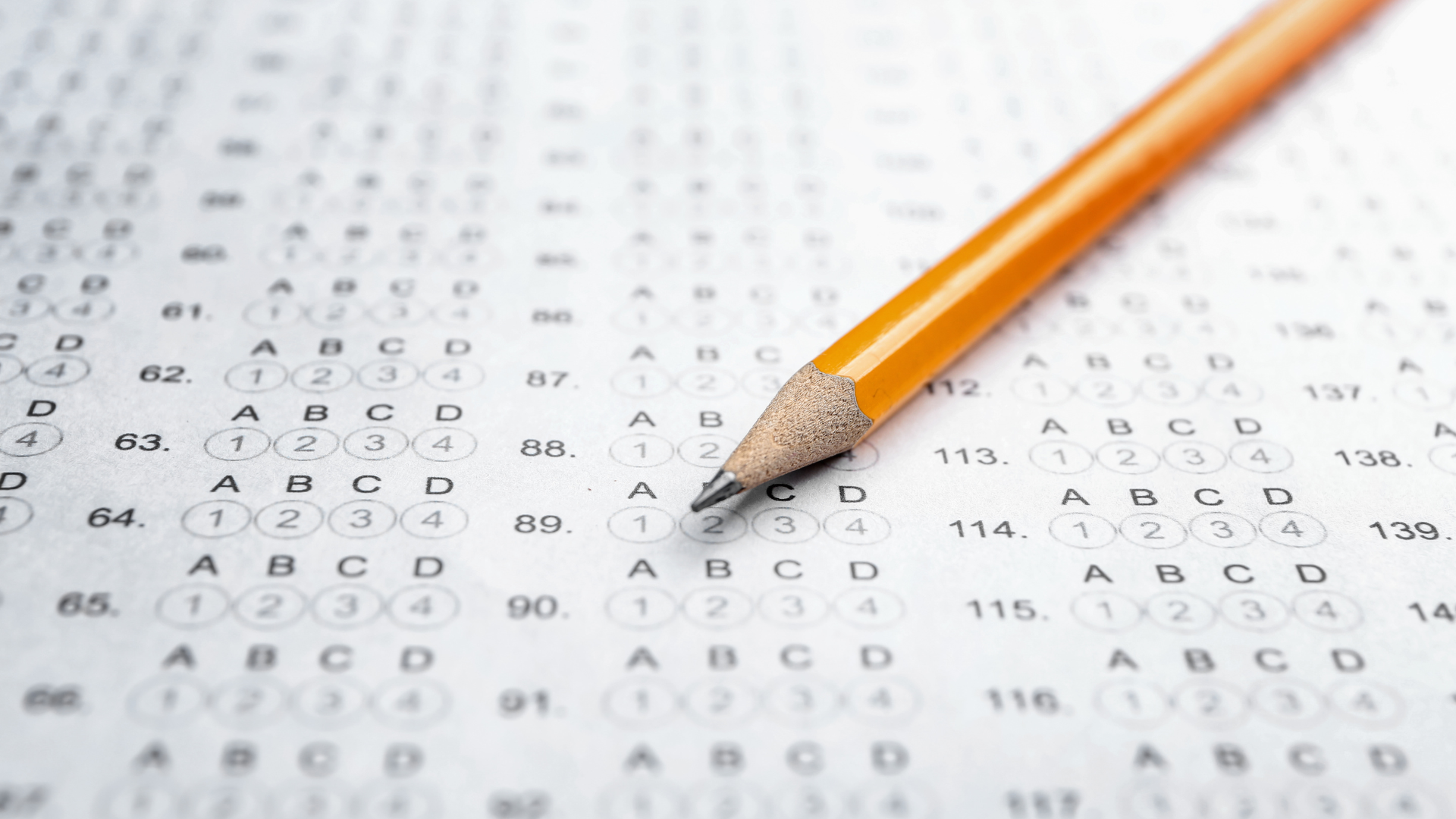 A pencil sits on a test scantron.